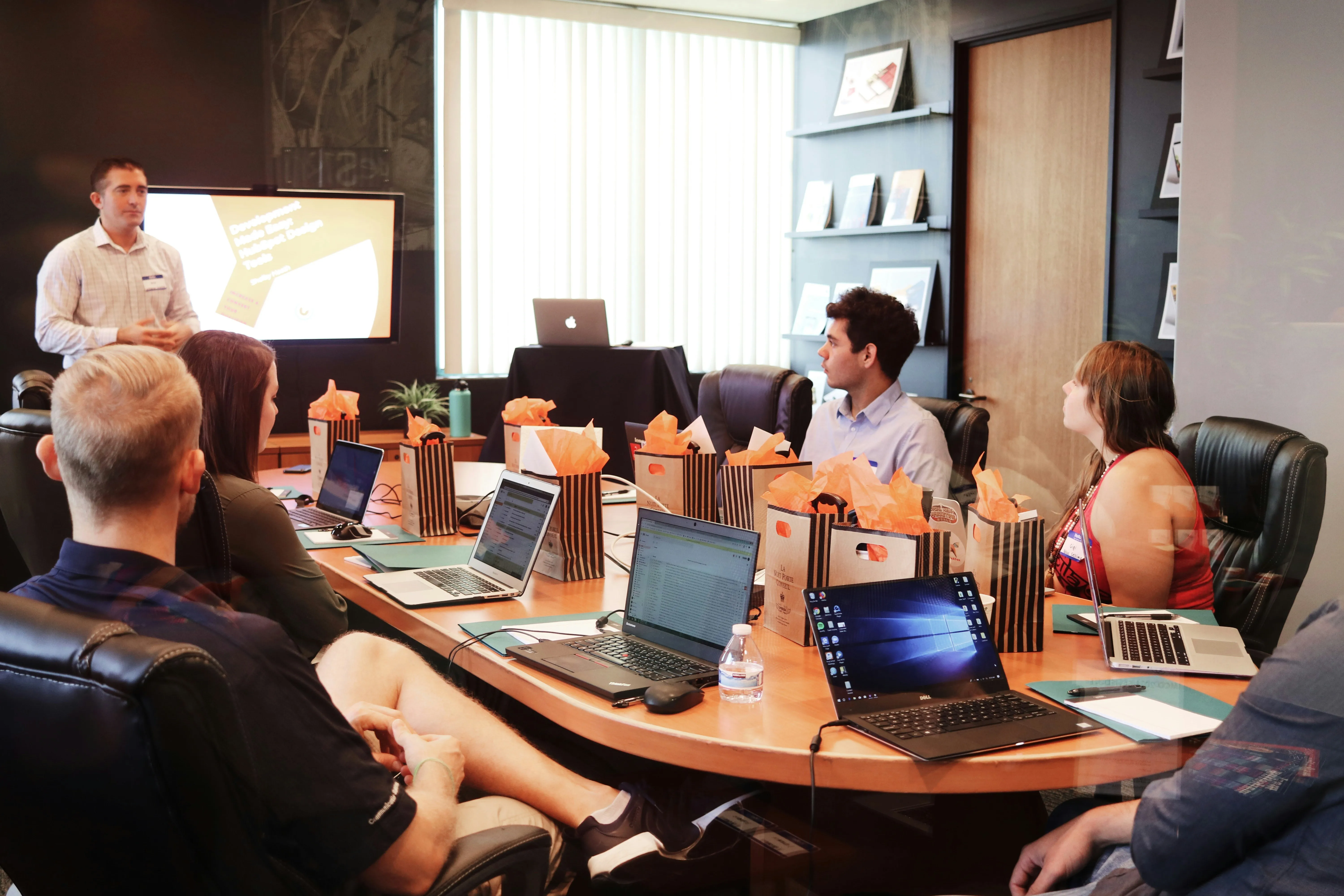 Students running a company meeting